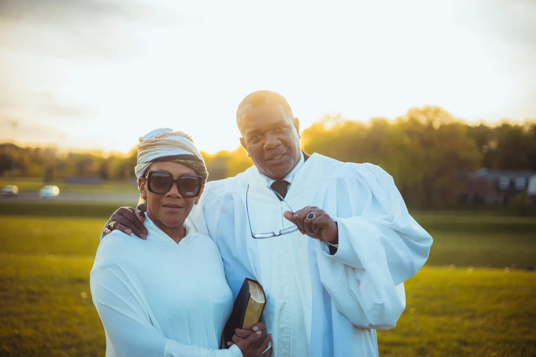 Pastor and lay partner outdoors.