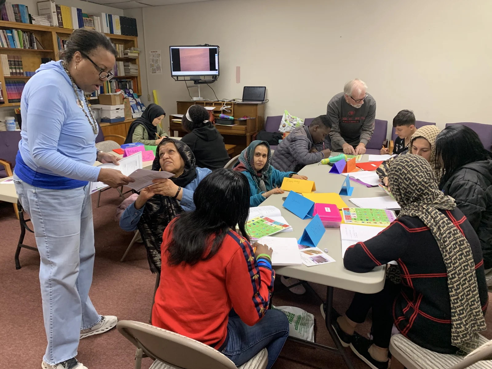 Participants learn together around tables at First UMC Modesto.