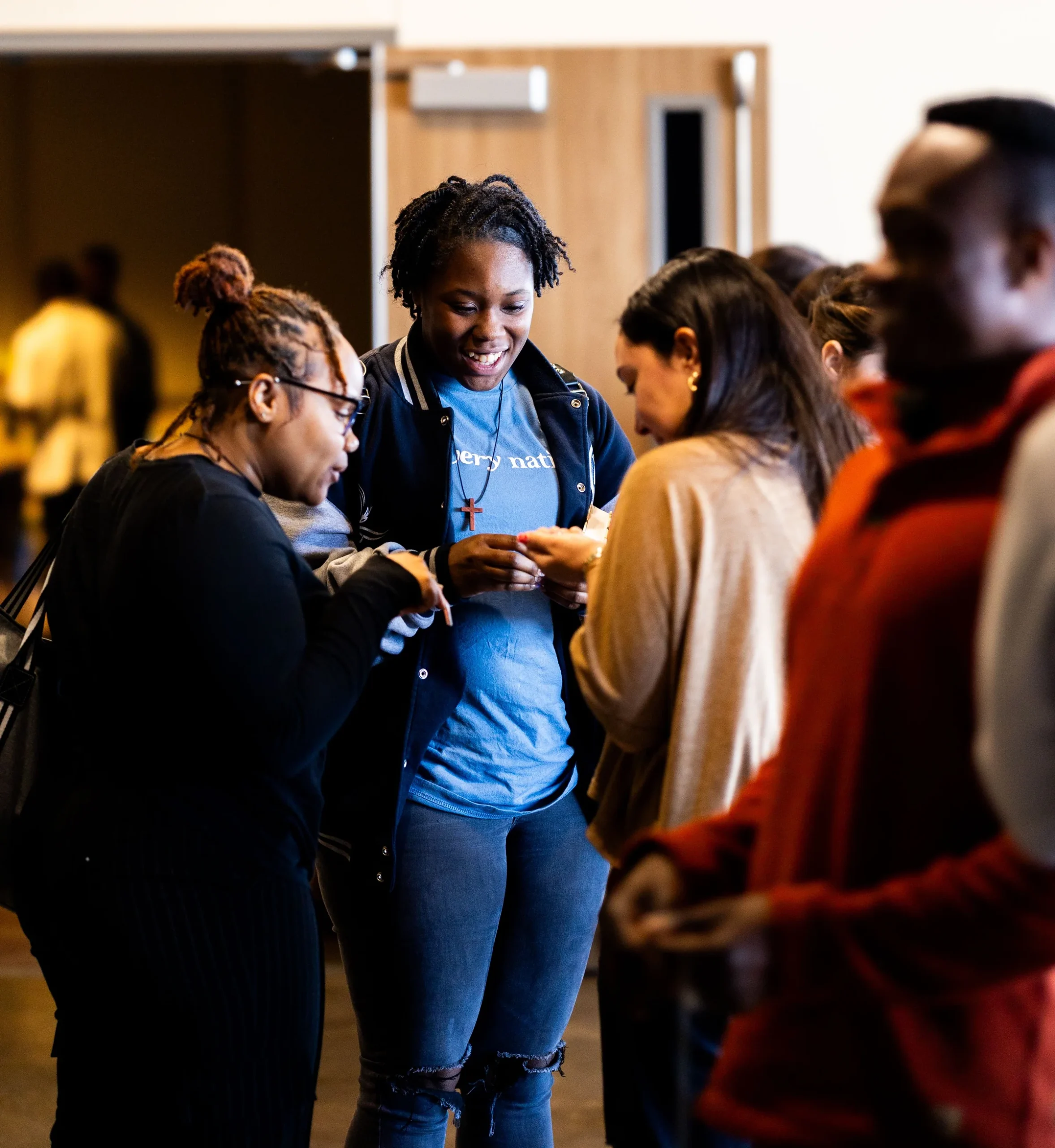People sharing a conversation at a community gathering.