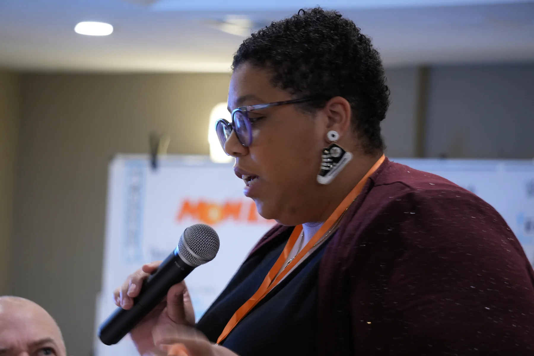 Fellow speaking at a gathering.
