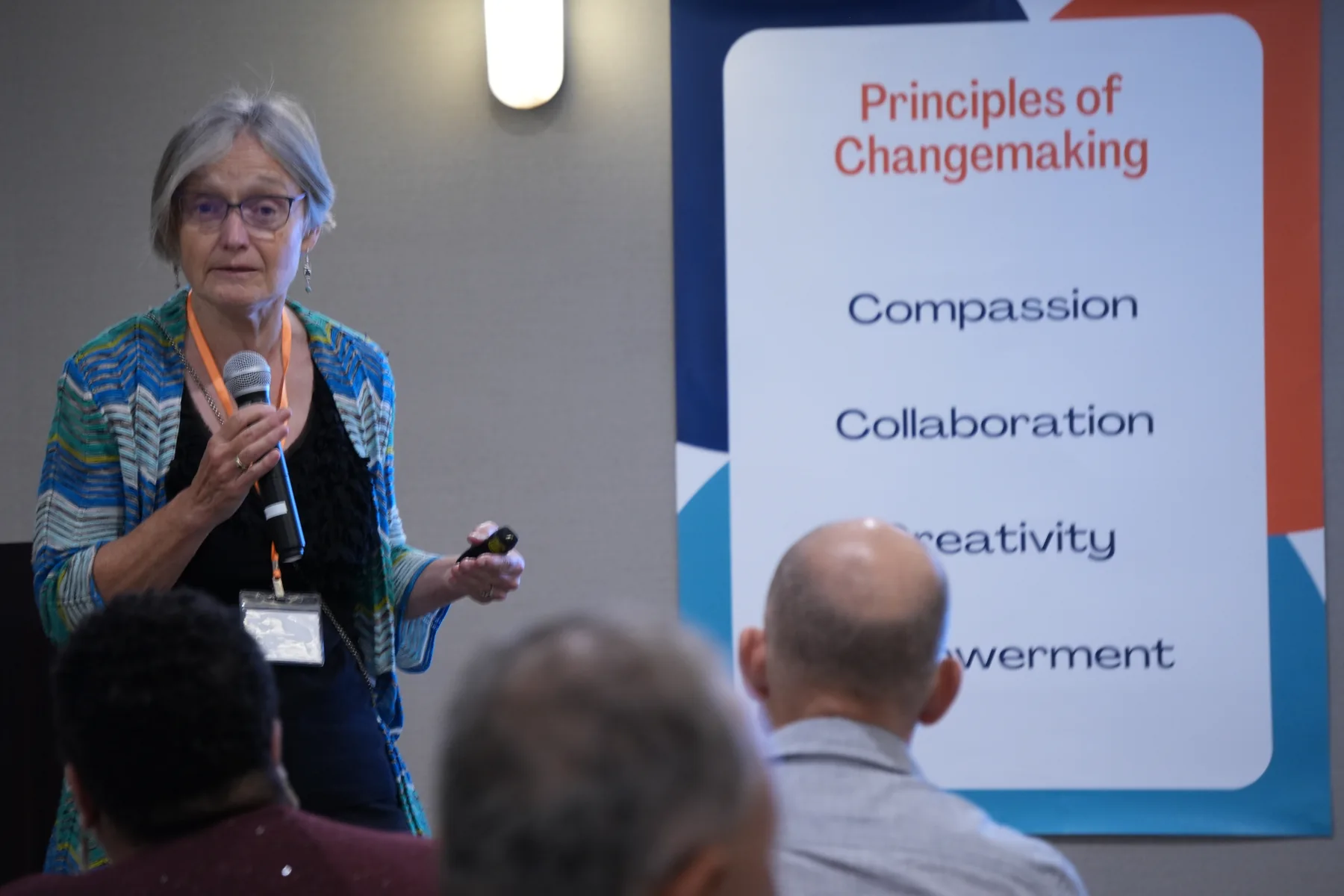 Christy speaking at a gathering.