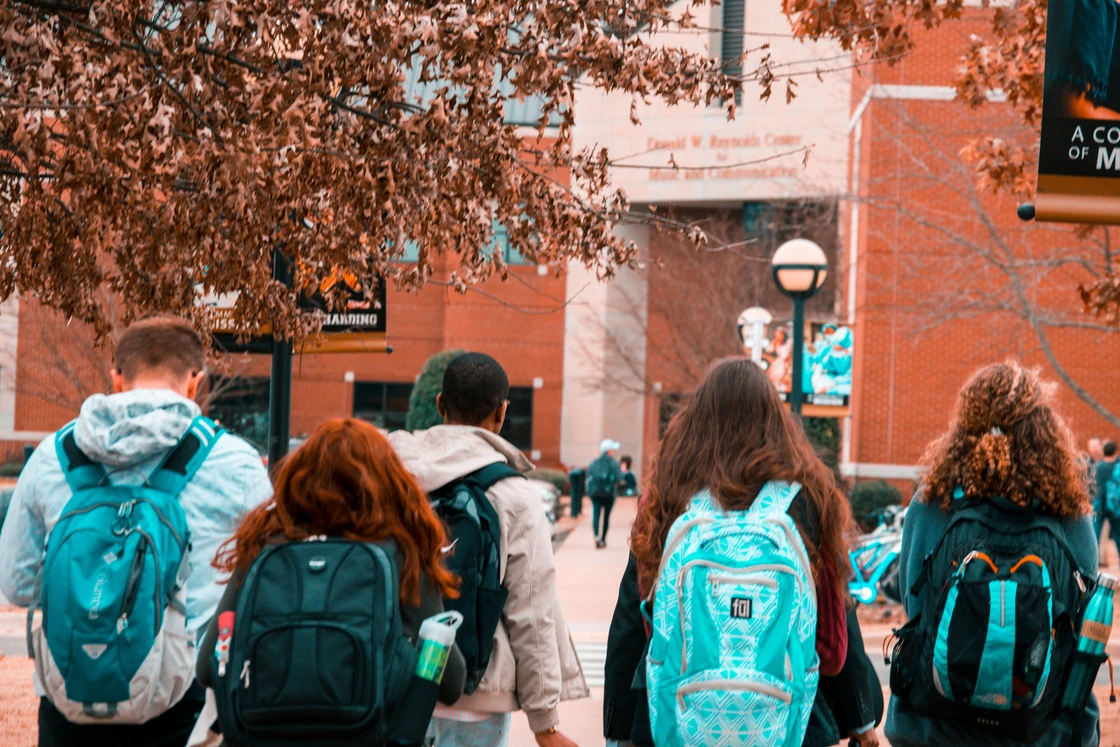 A group walking toward a community center.